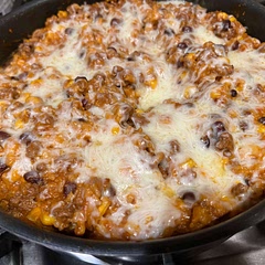 Everyone ate it, which is a win. I was out of Mexican cheeses, but I had easy melt (velveeta) that I put in the middle which gave it a queso flair, and mozzarella on top. I would t do the mozza again, but this is a definite cold evening crown pleaser. 
Based on other notes, I added extra water and added a can of tomato sauce instead of paste and simmered at least 20 minutes. I also used taco seasoning instead of the list of spices.