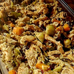 I made quite a few tweaks using tips from others below.
1. I marinated the chicken in olive oil, salt, pepper, minced garlic, and paprika for about 4 hours.
2. I chopped and seasoned the vegetables and baked them in the 9x13 for 10min at 375.
3. When they were done, I placed the chicken breast on top of the veggies and baked for another 20min.
4. For my rice, I used Uncle Ben's Wild Rice and cooked according to the box, except I used chicken broth. The seasoned rice added a ton of flavor!
5. When the chicken/vegetables were done, I took the chicken out and shredded it. Added it back to the vegetables and baked for another 3 min.
6. While that was baking, I added the rice, toasted almonds, and cranberries to a bowl and mixed them together.
7. When the three minutes was up, I added the rice mixture and 1/4 broth to the chicken and vegetables and then served.