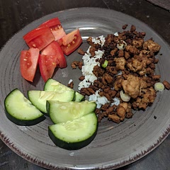 Very yum, reminds me of maple breakfast sausage. I couldn't successfully reduce the sugar as others have. Don't crumble too small because they get even smaller as you keep stirring. I had trouble when I doubled the recipe but I'll be trying x1.5. I love the cucumber and tomato alongside it!

~
1 ½ tbsp oil over high heat

Add ~½ c. finely diced 🧅, 2 tsp minced 🫚, 2 minced 🧄 cloves, and 1 finely chopped chili. Cook 2 mins.

Add pork and cook ~2 mins until white all over, breaking up with spoon. 
Add 5 tbsp brown sugar and 2 tbsp soy sauce. 
Stir, leaving to cook without touching until all the juices cook out and the pork starts to caramelize, ~2 mins. Then stir and leave it again for around 30 seconds. Repeat twice.

Serve over 🍚, garnished with sliced scallions. 
