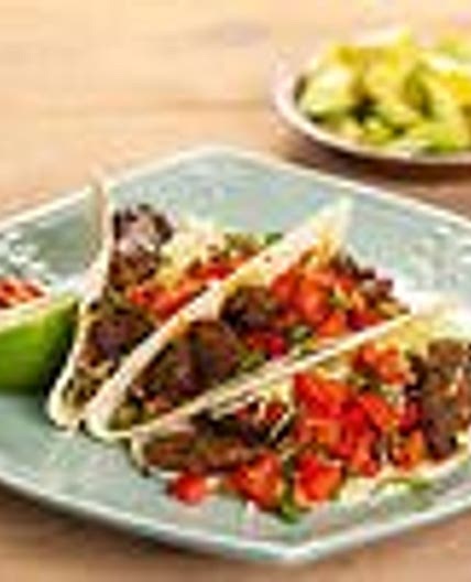 Spicy kangaroo tacos with pico de gallo salsa